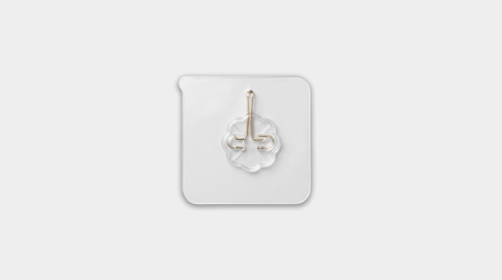 Self adhesive hook included in the bag.